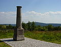 meridian fixed point from 1864 in foreground, Klínovec in background