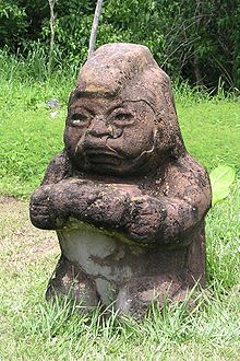 "The Grandmother", La Venta (reproduction). Officially known as Monument 5, this statue is thought to represent a kneeling "baby-face" figure. Mexico.Tab.LaVenta.01.jpg