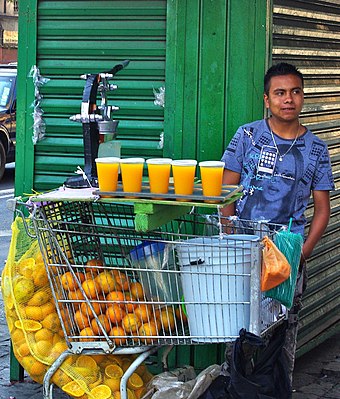 Mexico City merchant with his freshly squeezed orange juice, March 2010