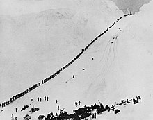 Miners and prospectors climb the Chilkoot Trail during the 1898 Klondike Gold Rush. Miners climb Chilkoot.jpg