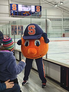 Otto the Orange entertains the audience at Syracuse Orange women's ice hockey game at the Tennity Ice Skating Pavilion (2023). Otto the Orange entertains the audience at Syracuse women's ice hockey game against Rensselaer Polytechnic Institute at the Tennity Ice Skating Pavilion, Syracuse University 16.jpg