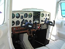 Typical light aircraft (Cessna 150M) cockpit with control yokes Pilotska kabina zrakoplova.JPG