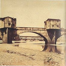 Photograph of Ponte alle Grazie in 1860s, with Ponte Vecchio in background. Ponte alle grazie, 1860s.jpg