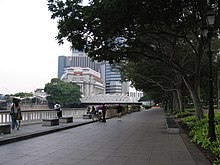 The Queen Elizabeth Walk was the proposed site for the national memorial. In the background is the Fullerton Hotel (building in white), where the memorial stone was initially erected in 1970. Queen Elizabeth Walk, Aug 06.JPG