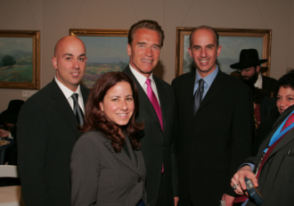 Dr. Pedram Salimpour (left) and brother Dr. Pejman Salimpour (right) with former California Governor Arnold Schwarzenegger. Salimpour Arnold.png