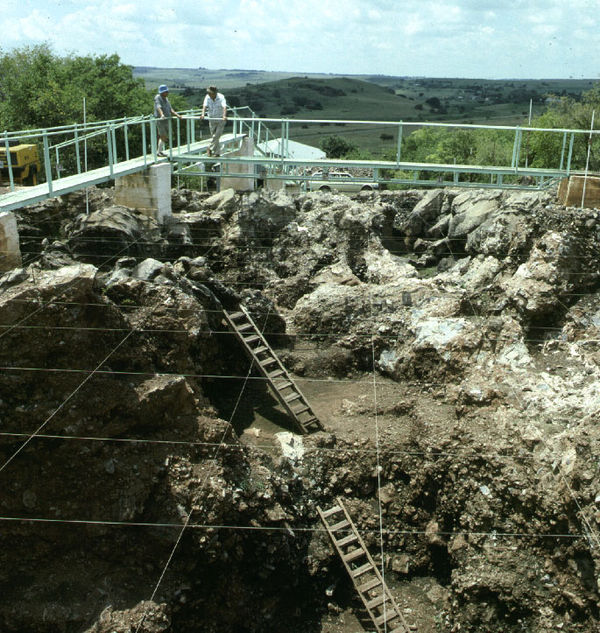 Archaeologists in a structure above the entrance to Sterkfontein