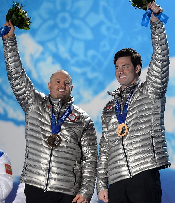 Steven Holcomb and Steve Langton, on 2014 Sochi Olympics podium with two-man bobsleigh bronze medals – later upgraded to silver.