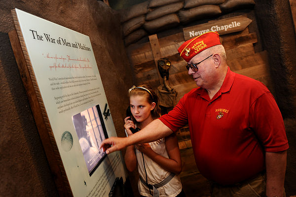 People visiting a World War I exhibit at the National Churchill Museum, located on the Westminster College Campus