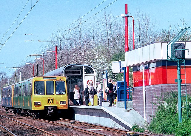 A Tyne & Wear Metro train heading for South Shields stopping at Kingston Park station