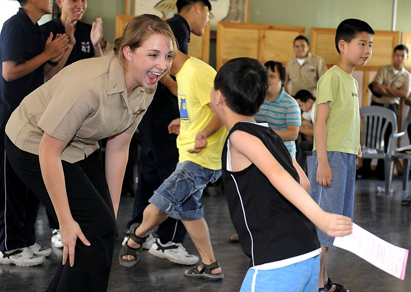 File:U.S. Navy Seaman Apprentice Jenna Welsh (left), assigned to the U.S. 7th Fleet command ship USS Blue Ridge (LCC 19), dances with Kim Young Min during a community service project at Cheonma Jaehwalwon 100824-N-XG305-289.jpg