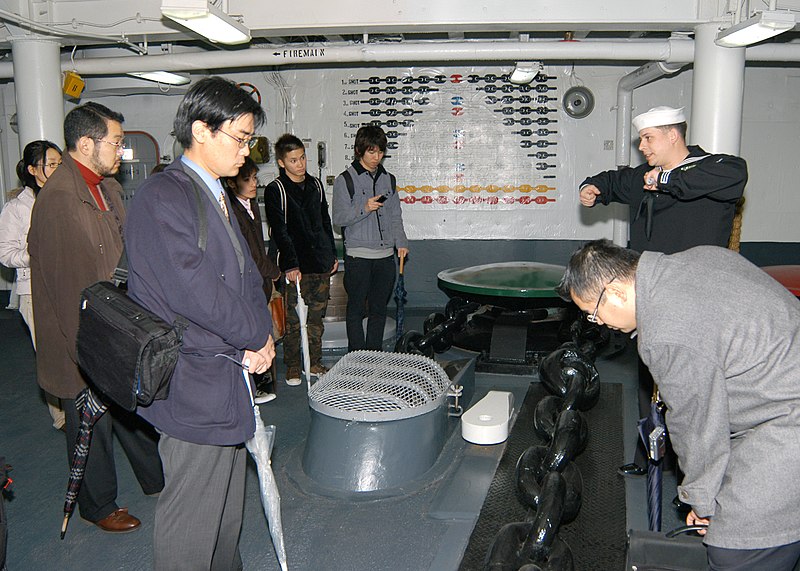 File:US Navy 060201-N-9860Y-129 Boatswain's Mate 1st Class David A. Slodysko describes the anchor chain of the 7th Fleet Command and Control ship, USS Blue Ridge (LCC 19) to a group of Japanese students and professors from several N.jpg