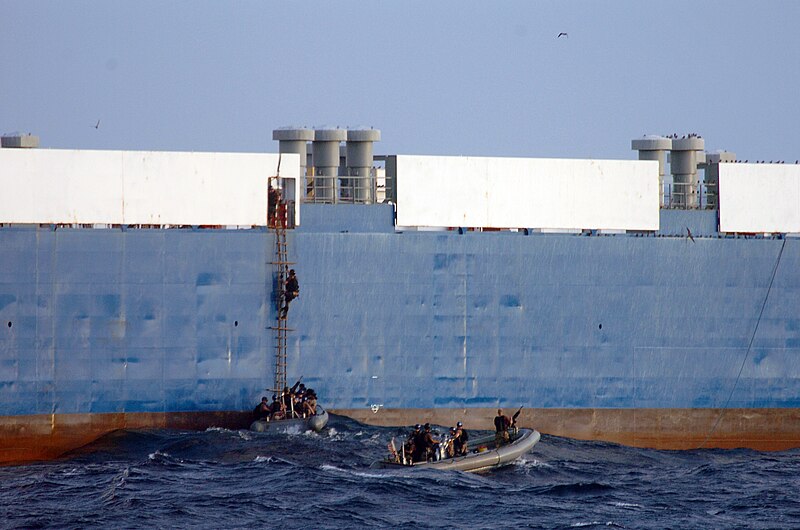 File:US Navy 090206-N-3931M-015 Sailors from the Norfolk-based destroyer USS Mason (DDG 87) climb aboard Motor Vessel Faina to conduct a health and comfort inspection of the crew as well as provide them with food, water and medical.jpg