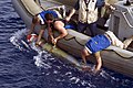 US Navy 090526-N-0743B-028 ailors aboard the guided-missile cruiser USS Gettysburg (CG 64) recover an Mk-46 recoverable exercise torpedo (REXTORP) during an over-the-side surface vessel torpedo tube exercise.jpg