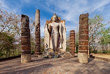 A Leela Buddha statue in the ruins of Wat Saphan Hin in Sukhothai Historical Park, built in Sukhothai period Wat Saphan Hin (I).jpg