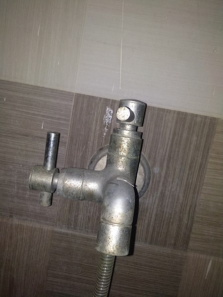 Two way water tap used in restroom.