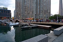 The Simcoe WaveDeck is one of several WaveDecks built along the waterfront. These public spaces were built in an effort to revitalize the waterfront. Wavedeck at Simcoe and Queens Quay.jpg