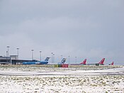 Leeds Bradford Airport following heavy snowfall on 27 December 2009. Aircraft in the snow at Leeds Bradford Airport.jpg