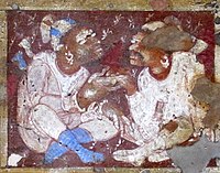 Foreigners sharing a drink of wine, ceiling of Cave 2.[203]