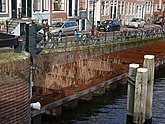 Amsterdam old city, brick quay reconstructions of the canal Nieuwe Herengracht; free photo by Fons Heijnsbroek, 10 April 2022