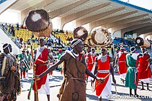 Men in colourful clothing with drums Burundi tradition.jpg