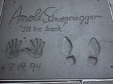 Footprints and handprints of Arnold Schwarzenegger in front of the Grauman's Chinese Theatre, with his catchphrase "I'll be back" written in Chth arnold schwarzenegger.jpg