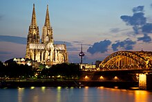 Cologne Cathedral Cologne Cathedral and the Hohenzollern Bridge.jpg