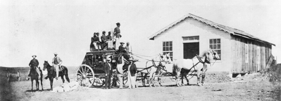 Typical stagecoach of the Concord type used by express companies on the overland trails. Soldiers guard from atop, ca. 1869 Concord stagecoach 1869.png