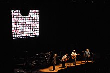 One of the backdrops during the 2006 "Freedom of Speech" tour, as shown here, was the photos of American soldiers who had died in the war in Iraq. Csny-06-tour.jpg