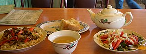 A simple meal at a small Dungan- (Huizu-)style restaurant in Dordoy Bazaar, Bishkek. Laghman (a noodle dish), salad, bread, and tea. E7870-dordoy-laghman-crop-768.jpg