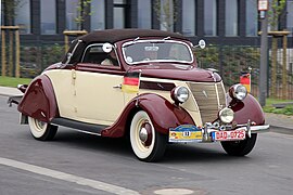 Ford V8 from 1937 with body made by Karl Deutsch GmbH in motion, front and right side