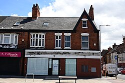 A former NatWest branch on Holderness Road, Kingston upon Hull, which closed on 11 July 2023. The former 'National Westminster Bank' signage is now visible due to the removal of the NatWest signage.