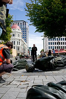 The Godley Statue fell off its plinth in the February 2011 Christchurch earthquake. Godley Statue toppled.jpg