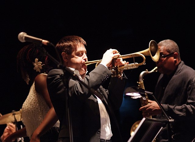 English musician Guy Barker (pictured in 2007, middle) played a trumpet solo on "Through the Years"