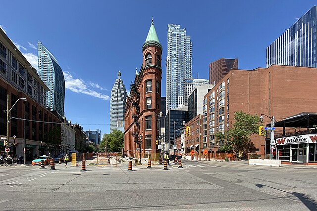 Looking west along Front Street towards the intersection of Front and Church Streets, with the Gooderham Building in the foreground and Brookfield Pla