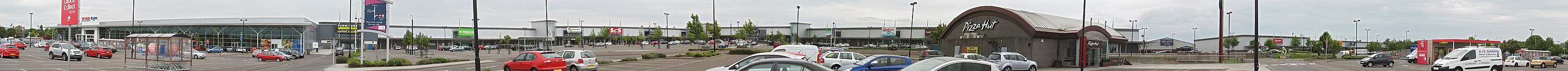 Kingsway West Retail Park in Dundee, Scotland, via a wide image that shows parking areas and customer vehicles