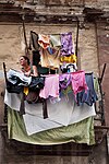 Lady hanging laundry, Havana, Cuba 2011.jpg