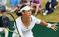 Liu Fangzhou competing in the second round of the 2015 Wimbledon Qualifying Tournament at the Bank of England Sports Grounds in Roehampton, England. The winners of three rounds of competition qualify for the main draw of Wimbledon the following week.