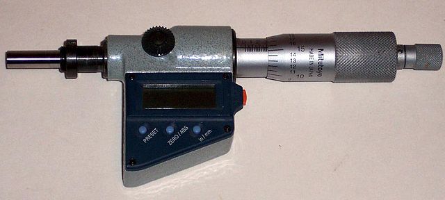 A mechanical linear actuator with digital readout (a type of micrometer).