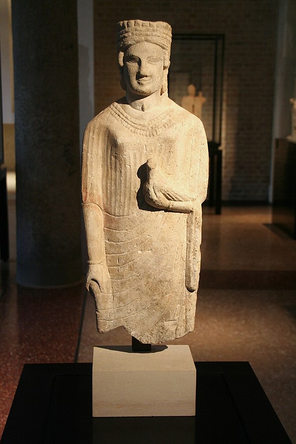 Early fifth-century BC statue of Aphrodite from Cyprus, showing her wearing a cylinder crown and holding a dove