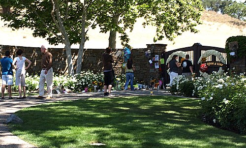 Fans visiting the makeshift memorial set up outside the Neverland Ranch entrance shortly after Jackson's death.