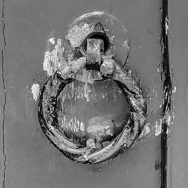 Worn door handle of the Nicolaaskerk (Hemelum) is a hall church built in 1668.