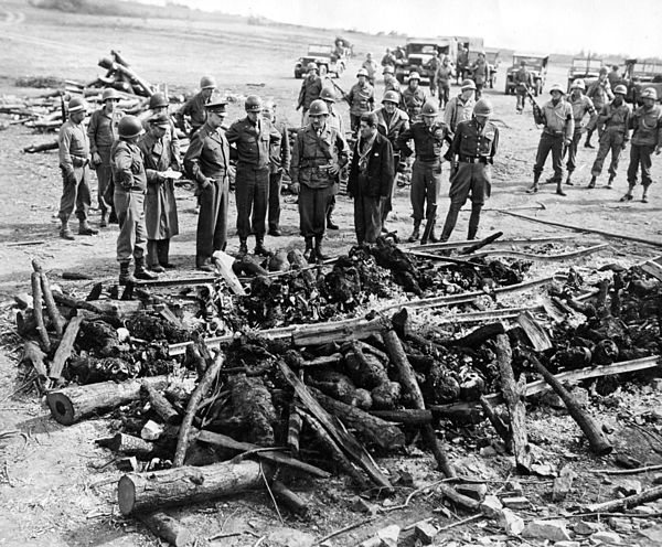 April 12, 1945: Generals Dwight D. Eisenhower, Omar Bradley and George S. Patton inspect an improvised crematory pyre at Ohrdruf concentration camp.