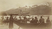 Olympian in Alaska, summer 1887. Tlingit people shown in foreground. Olympian (sidewheeler) in Alaska 1887.jpg