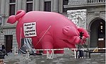 The Payraise Pig, one of Stilp's political props, in front of the Pennsylvania State Capitol in 2005. PinkPiginHarrisburg.jpg