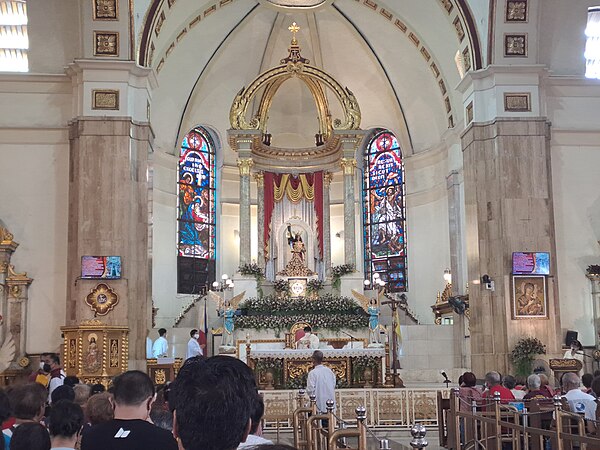 High altar of the church, with the Black Nazarene enshrined above it