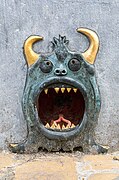 Relief of a devil's head with golden horns and sharp teeth in Rue du Grand Hospice Brussels Belgium.jpg