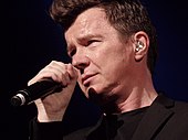 Rick Astley (pictured in 2017) had the distinction of charting the last non-canonical number-one in 1988 with "Together Forever." Rick Astley Dallas.jpg