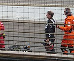 Marty Roth (in black) after exiting his damaged car. Roth 2008 Indy 500.jpg
