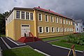 alt=Photograph of the two-story, yellow Russian Bishop's House.