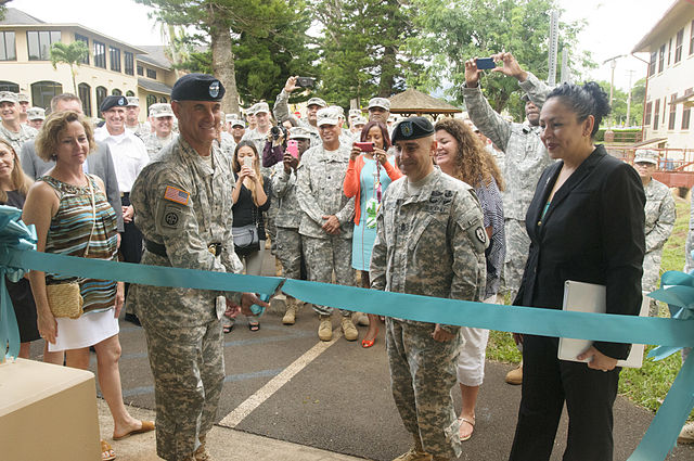 Major General Charles A. Flynn cuts the ceremonial ribbon during the opening of the SHARP Resource Center on Schofield Barracks, October 17, 2014.